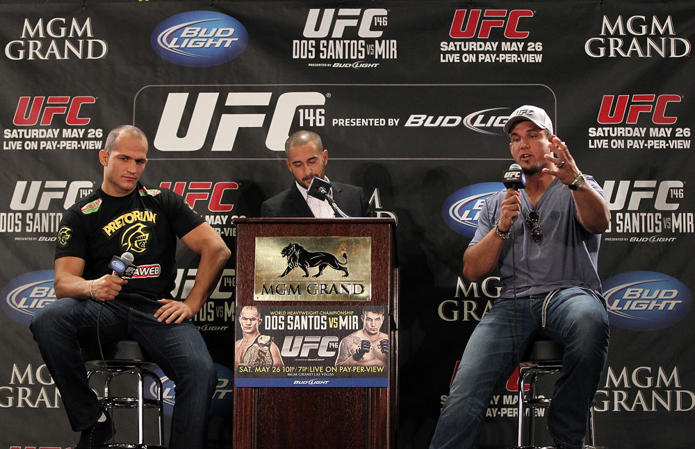 LAS VEGAS, NV - MAY 24: UFC Heavyweight Champion Junior dos Santos (L) and opponent Frank Mir (R) attend the UFC 146 press conference hosted by Jon Anik (center) at MGM Grand on May 24, 2012 in Las Vegas, Nevada. (Photo by Josh Hedges/Zuffa LLC/Zuffa LLC via Getty Images)