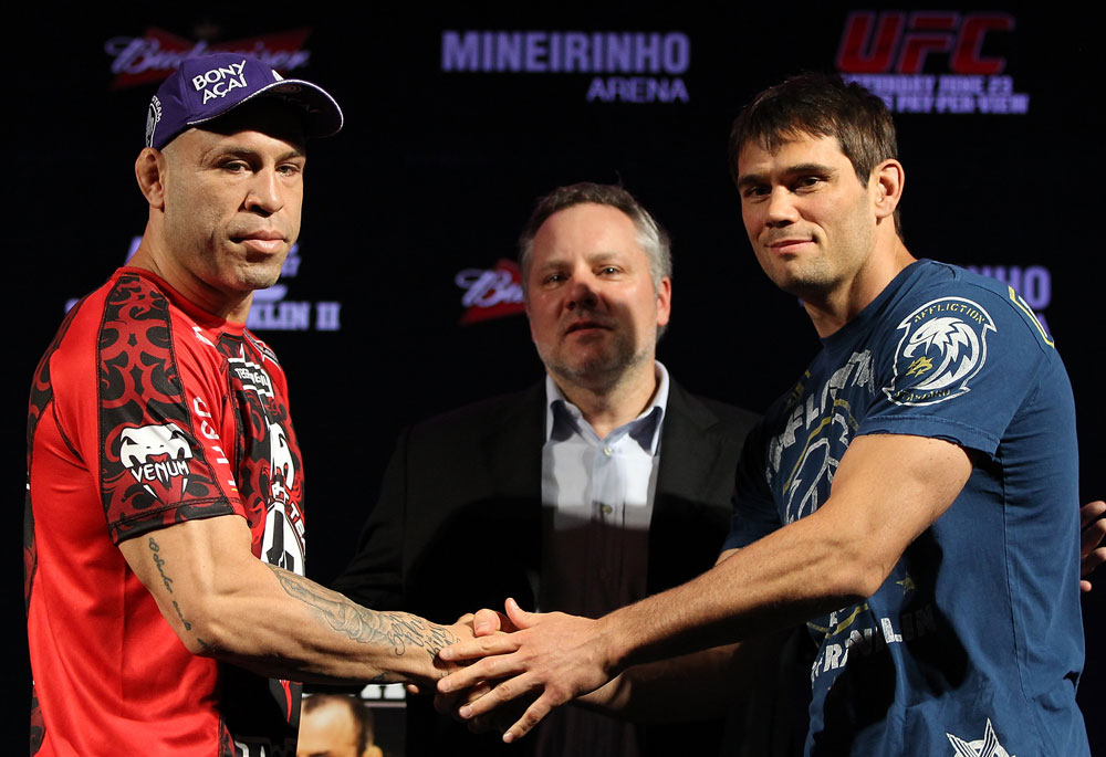BELO HORIZONTE, BRAZIL - JUNE 21:   (L-R) Opponents Wanderlei Silva and Rich Franklin shake hands during the UFC 147 press conference at Ouro Minas Palace on June 21, 2012 in Belo Horizonte, Brazil.  (Photo by Josh Hedges/Zuffa LLC/Zuffa LLC via Getty Images)