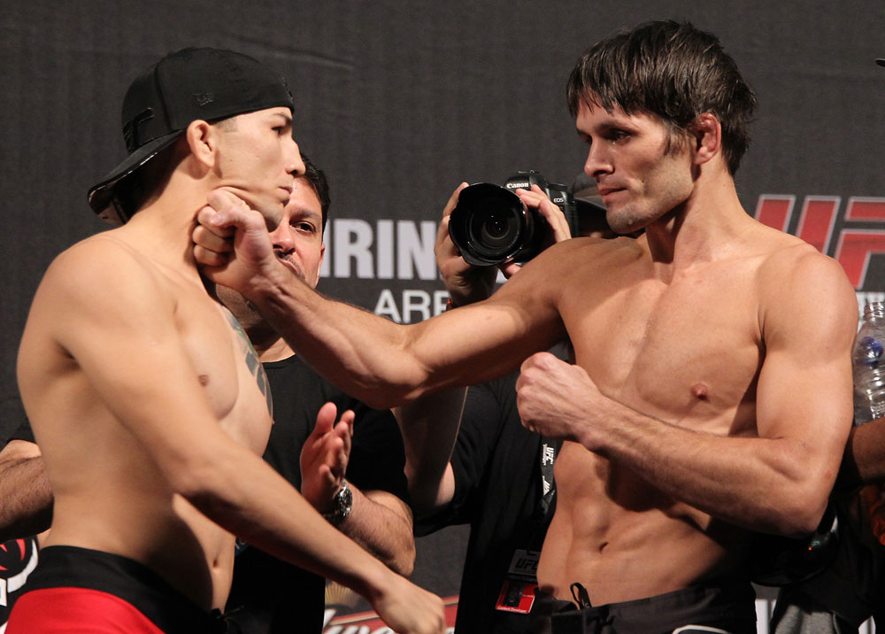 BELO HORIZONTE, BRAZIL - JUNE 22:   (L-R) Opponents Anistavio Medeiros and Rodrigo Damm face off during the UFC 147 weigh in at Estadio Jornalista Felipe Drummond on June 22, 2012 in Belo Horizonte, Brazil.  (Photo by Josh Hedges/Zuffa LLC/Zuffa LLC via Getty Images)