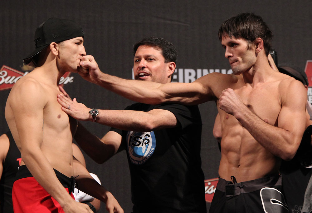 BELO HORIZONTE, BRAZIL - JUNE 22:   (L-R) Opponents Anistavio Medeiros and Rodrigo Damm are separated after facing off during the UFC 147 weigh in at Estadio Jornalista Felipe Drummond on June 22, 2012 in Belo Horizonte, Brazil.  (Photo by Josh Hedges/Zuffa LLC/Zuffa LLC via Getty Images)