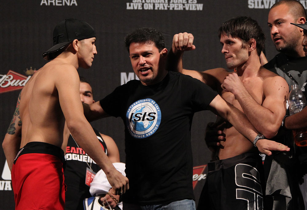 BELO HORIZONTE, BRAZIL - JUNE 22:   (L-R) Opponents Anistavio Medeiros and Rodrigo Damm are separated after facing off during the UFC 147 weigh in at Estadio Jornalista Felipe Drummond on June 22, 2012 in Belo Horizonte, Brazil.  (Photo by Josh Hedges/Zuffa LLC/Zuffa LLC via Getty Images)