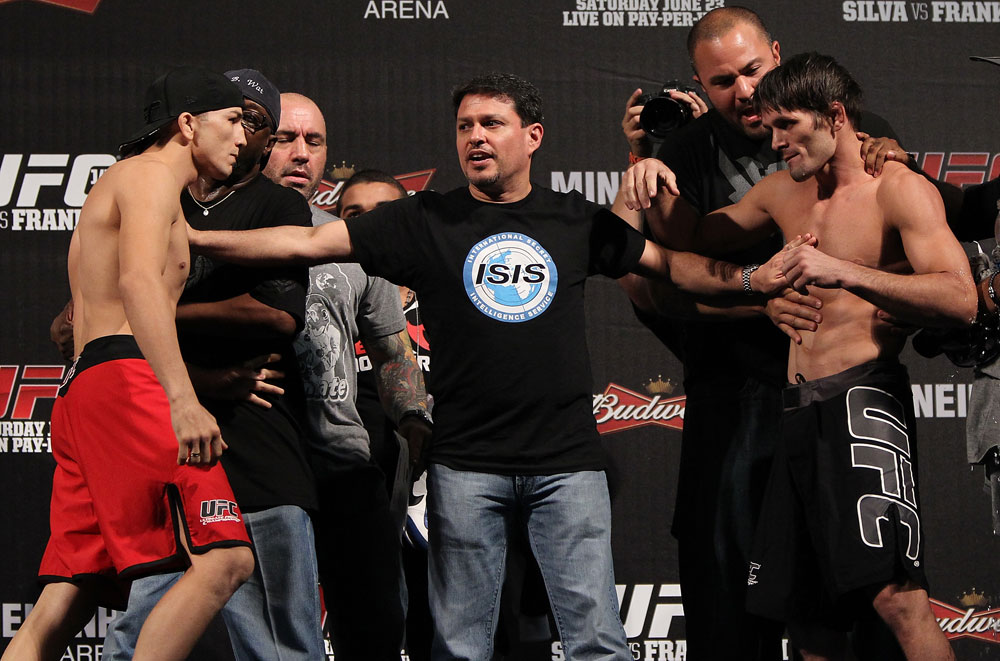 BELO HORIZONTE, BRAZIL - JUNE 22:   (L-R) Opponents Anistavio Medeiros and Rodrigo Damm are separated after facing off during the UFC 147 weigh in at Estadio Jornalista Felipe Drummond on June 22, 2012 in Belo Horizonte, Brazil.  (Photo by Josh Hedges/Zuffa LLC/Zuffa LLC via Getty Images)