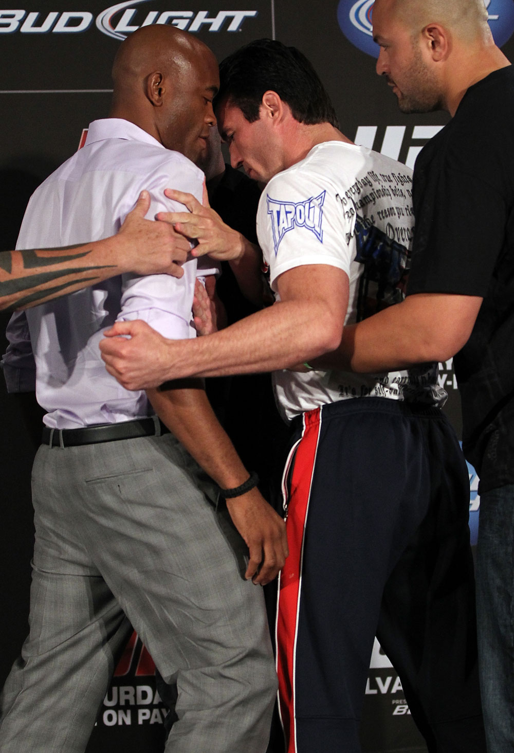 LAS VEGAS, NV - JULY 3:   (L-R) Opponents Anderson Silva and Chael Sonnen are separated by UFC President Dana White during the UFC 148 press conference at Lagasse's Stadium inside The Palazzo on July 3, 2012 in Las Vegas, Nevada.  (Photo by Josh Hedges/Zuffa LLC/Zuffa LLC via Getty Images)