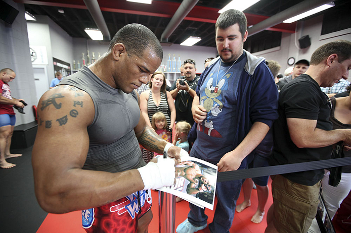 CALGARY, CANADA - JULY 18: Hector Lombard signs autographs after he works out for the fans and media during the UFC 149 Open Workouts inside Champion's Creed Gym on July 18, 2012 in Calgary, Alberta, Canada. (Photo by Jeff Bottari/Zuffa LLC/Zuffa LLC via Getty Images)