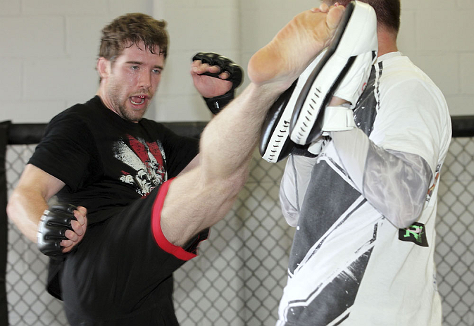 CALGARY, CANADA - JULY 18: Mitch Clarke works out for the fans and media during the UFC 149 Open Workouts inside Champion's Creed Gym on July 18, 2012 in Calgary, Alberta, Canada. (Photo by Jeff Bottari/Zuffa LLC/Zuffa LLC via Getty Images)