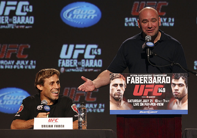 CALGARY, CANADA - JULY 19: Urijah Faber and UFC President Dana White share a moment on stage at the UFC 149 press conference at the Flames Central Sports Club on July 19, 2012 in Calgary, Alberta, Canada. (Photo by Jeff Bottari/Zuffa LLC/Zuffa LLC via Getty Images)