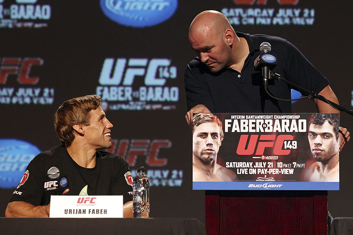 CALGARY, CANADA - JULY 19: Urijah Faber and UFC President Dana White share a moment on stage at the UFC 149 press conference at the Flames Central Sports Club on July 19, 2012 in Calgary, Alberta, Canada. (Photo by Jeff Bottari/Zuffa LLC/Zuffa LLC via Getty Images)