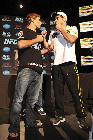 CALGARY, CANADA - JULY 19: Urijah Faber and Renan Barao square off at the UFC 149 press conference at the Flames Central Sports Club on July 19, 2012 in Calgary, Alberta, Canada. (Photo by Jeff Bottari/Zuffa LLC/Zuffa LLC via Getty Images)