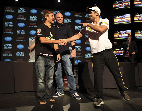 CALGARY, CANADA - JULY 19: Urijah Faber and Renan Barao shake hands after squaring off at the UFC 149 press conference at the Flames Central Sports Club on July 19, 2012 in Calgary, Alberta, Canada. (Photo by Jeff Bottari/Zuffa LLC/Zuffa LLC via Getty Images)