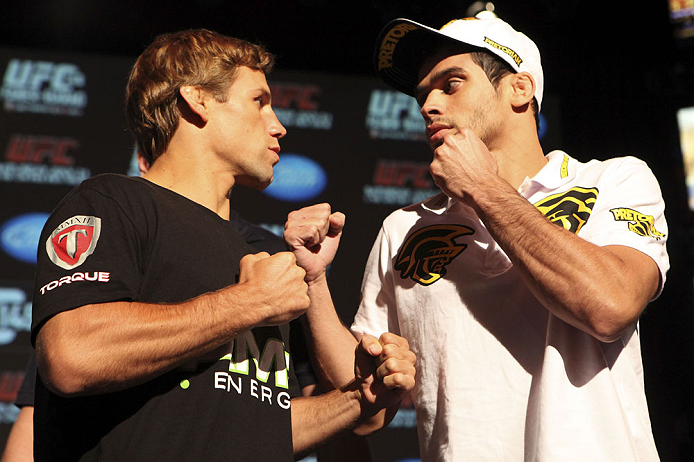 CALGARY, CANADA - JULY 19: Urijah Faber and Renan Barao square off at the UFC 149 press conference at the Flames Central Sports Club on July 19, 2012 in Calgary, Alberta, Canada. (Photo by Jeff Bottari/Zuffa LLC/Zuffa LLC via Getty Images)