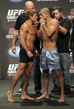 CALGARY, CANADA - JULY 20: Urijah Faber and Renan Barao square off at the UFC 149 weigh-in at the Scotiabank Saddledome on July 20, 2012 in Calgary, Alberta, Canada. (Photo by Jeff Bottari/Zuffa LLC/Zuffa LLC via Getty Images)