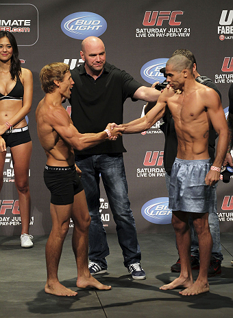CALGARY, CANADA - JULY 20: Urijah Faber and Renan Barao shake hands after they face off at the UFC 149 weigh-in at the Scotiabank Saddledome on July 20, 2012 in Calgary, Alberta, Canada.  (Photo by Jeff Bottari/Zuffa LLC/Zuffa LLC via Getty Images)
