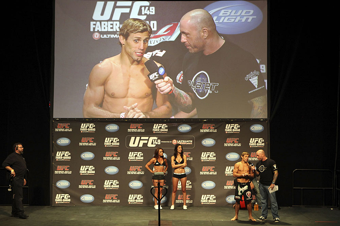CALGARY, CANADA - JULY 20: Urijah Faber is interviewed by Joe Rogan after making weight at the UFC 149 weigh-in at the Scotiabank Saddledome on July 20, 2012 in Calgary, Alberta, Canada.  (Photo by Jeff Bottari/Zuffa LLC/Zuffa LLC via Getty Images)