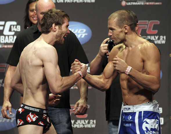 CALGARY, CANADA - JULY 20: Mitch Clarke and Anton Kuivanen face off at the UFC 149 weigh-in at the Scotiabank Saddledome on July 20, 2012 in Calgary, Alberta, Canada.  (Photo by Jeff Bottari/Zuffa LLC/Zuffa LLC via Getty Images)