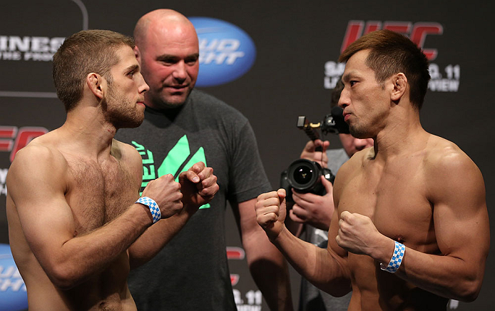 DENVER, CO - AUGUST 10: (L-R) Opponents Nik Lentz and Eiji Mitsuoka face off during the UFC 150 weigh in at Pepsi Center on August 10, 2012 in Denver, Colorado. (Photo by Josh Hedges/Zuffa LLC/Zuffa LLC via Getty Images)