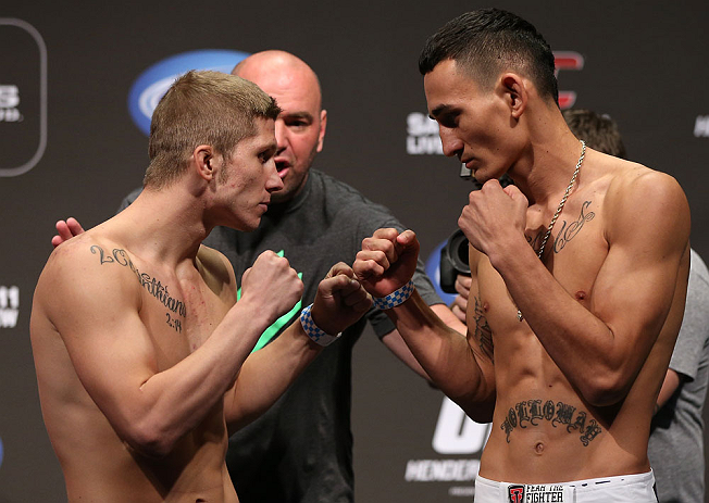 DENVER, CO - AUGUST 10: (L-R) Opponents Justin Lawrence and Max Holloway face off during the UFC 150 weigh in at Pepsi Center on August 10, 2012 in Denver, Colorado. (Photo by Josh Hedges/Zuffa LLC/Zuffa LLC via Getty Images)