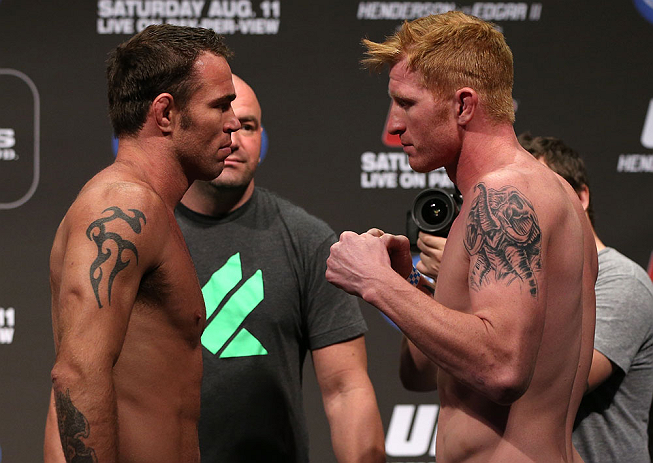 DENVER, CO - AUGUST 10: (L-R) Opponents Jake Shields and Ed Herman face off during the UFC 150 weigh in at Pepsi Center on August 10, 2012 in Denver, Colorado. (Photo by Josh Hedges/Zuffa LLC/Zuffa LLC via Getty Images)