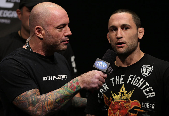 DENVER, CO - AUGUST 10: (R-L) Frankie Edgar is interviewed by Joe Rogan during the UFC 150 weigh in at Pepsi Center on August 10, 2012 in Denver, Colorado. (Photo by Josh Hedges/Zuffa LLC/Zuffa LLC via Getty Images)