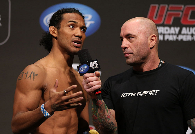 DENVER, CO - AUGUST 10: (L-R) Benson Henderson is interviewed by Joe Rogan during the UFC 150 weigh in at Pepsi Center on August 10, 2012 in Denver, Colorado. (Photo by Josh Hedges/Zuffa LLC/Zuffa LLC via Getty Images)