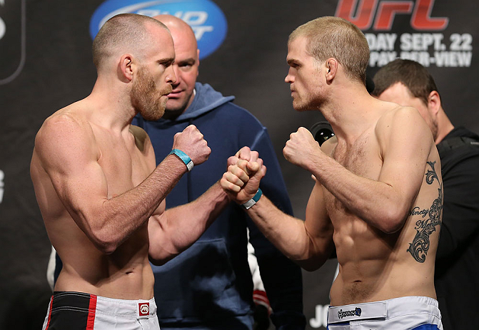 TORONTO, CANADA - SEPTEMBER 21: (L-R) Opponents T.J. Grant and Evan Dunham face off during the UFC 152 weigh in at Mattamy Athletic Centre at the Gardens on September 21, 2012 in Toronto, Ontario, Canada. (Photo by Josh Hedges/Zuffa LLC/Zuffa LLC via Getty Images)