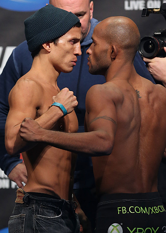 TORONTO, CANADA - SEPTEMBER 21: (L-R) Opponents Joseph Benavidez and Demetrious Johnson face off during the UFC 152 weigh in at Mattamy Athletic Centre at the Gardens on September 21, 2012 in Toronto, Ontario, Canada. (Photo by Josh Hedges/Zuffa LLC/Zuffa LLC via Getty Images)