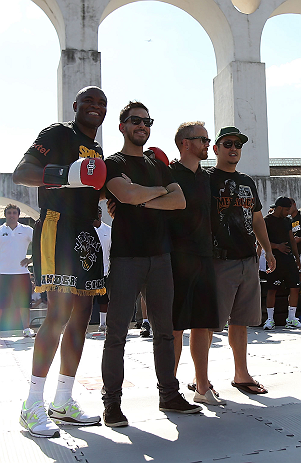 RIO DE JANEIRO, BRAZIL - OCTOBER 10: Anderson Silva (L) poses for a photo with members of rock band Linkin Park during an open training session ahead of UFC 153 at Arcos da Lapa: Praca Cardeal Camara on October 10, 2012 in Rio de Janeiro, Brazil. (Photo by Josh Hedges/Zuffa LLC/Zuffa LLC via Getty Images)