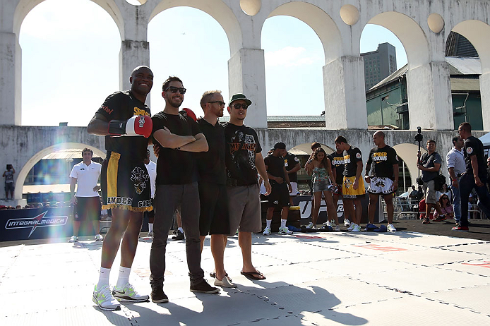 RIO DE JANEIRO, BRAZIL - OCTOBER 10: Anderson Silva (L) poses for a photo with members of rock band Linkin Park during an open training session ahead of UFC 153 at Arcos da Lapa: Praca Cardeal Camara on October 10, 2012 in Rio de Janeiro, Brazil. (Photo by Josh Hedges/Zuffa LLC/Zuffa LLC via Getty Images)