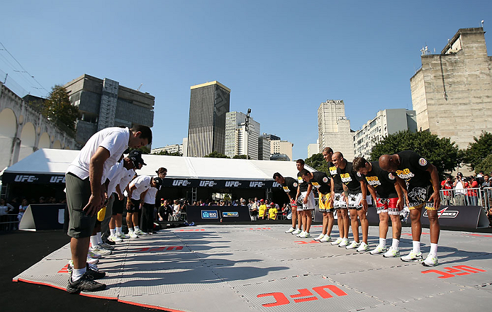 RIO DE JANEIRO, BRAZIL - OCTOBER 10: Anderson Silva (far right) and his teammates bow to their coaching staff after working out for fans and media during an open training session ahead of UFC 153 at Arcos da Lapa: Praca Cardeal Camara on October 10, 2012 in Rio de Janeiro, Brazil. (Photo by Josh Hedges/Zuffa LLC/Zuffa LLC via Getty Images)