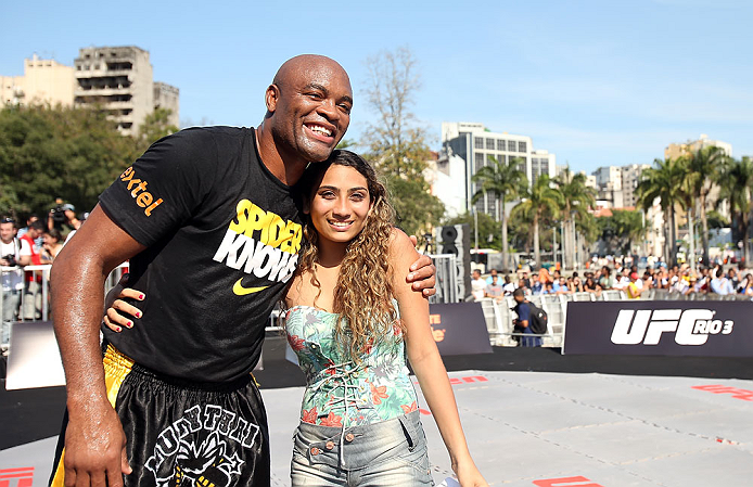 RIO DE JANEIRO, BRAZIL - OCTOBER 10: Anderson Silva poses for a photo with a fan after an open training session ahead of UFC 153 at Arcos da Lapa: Praca Cardeal Camara on October 10, 2012 in Rio de Janeiro, Brazil. (Photo by Josh Hedges/Zuffa LLC/Zuffa LLC via Getty Images)