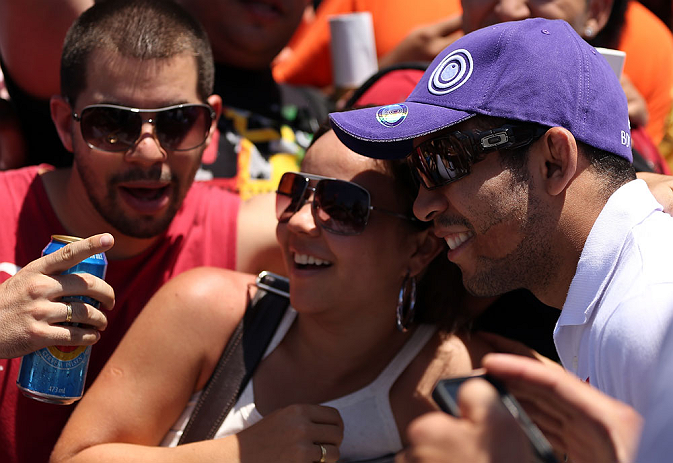 RIO DE JANEIRO, BRAZIL - OCTOBER 10:  UFC featherweight champion Jose Aldo greets fans during an open training session ahead of UFC 153 at Arcos da Lapa: Praca Cardeal Camara on October 10, 2012 in Rio de Janeiro, Brazil.  (Photo by Josh Hedges/Zuffa LLC/Zuffa LLC via Getty Images)