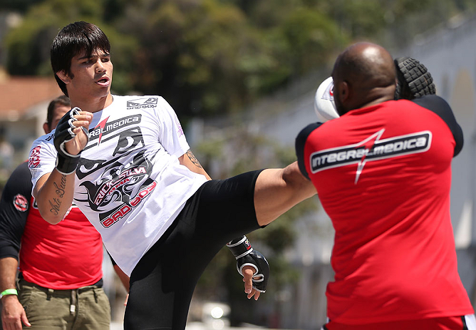 RIO DE JANEIRO, BRAZIL - OCTOBER 10: Erick Silva works out for fans and media during an open training session ahead of UFC 153 at Arcos da Lapa: Praca Cardeal Camara on October 10, 2012 in Rio de Janeiro, Brazil. (Photo by Josh Hedges/Zuffa LLC/Zuffa LLC via Getty Images)