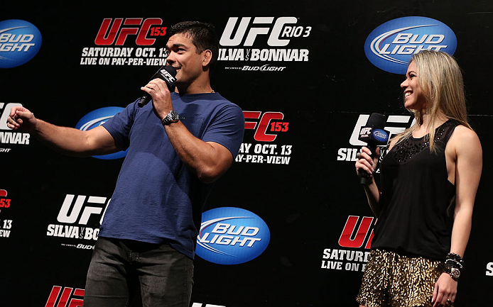 RIO DE JANEIRO, BRAZIL - OCTOBER 12:  (L-R) Lyoto Machida and Paula Sack interact with fans during a Q&A session before the UFC 153 weigh in at HSBC Arena on October 12, 2012 in Rio de Janeiro, Brazil.  (Photo by Josh Hedges/Zuffa LLC/Zuffa LLC via Getty Images)