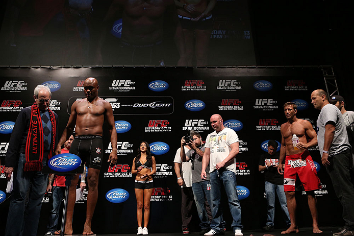 RIO DE JANEIRO, BRAZIL - OCTOBER 12:  Anderson Silva (L) weighs in as opponent Stephan Bonnar (R) looks on during the UFC 153 weigh in at HSBC Arena on October 12, 2012 in Rio de Janeiro, Brazil.  (Photo by Josh Hedges/Zuffa LLC/Zuffa LLC via Getty Images)