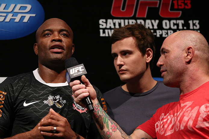 RIO DE JANEIRO, BRAZIL - OCTOBER 12:  Anderson Silva (L) is interviewed by Joe Rogan (R) during the UFC 153 weigh in at HSBC Arena on October 12, 2012 in Rio de Janeiro, Brazil.  (Photo by Josh Hedges/Zuffa LLC/Zuffa LLC via Getty Images)