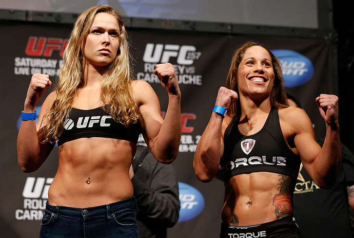 ANAHEIM, CA - FEBRUARY 22:  (L-R) Opponents Ronda Rousey and Liz Carmouche pose for photos during the UFC 157 weigh-in at Honda Center on February 22, 2013 in Anaheim, California.  (Photo by Josh Hedges/Zuffa LLC/Zuffa LLC via Getty Images)