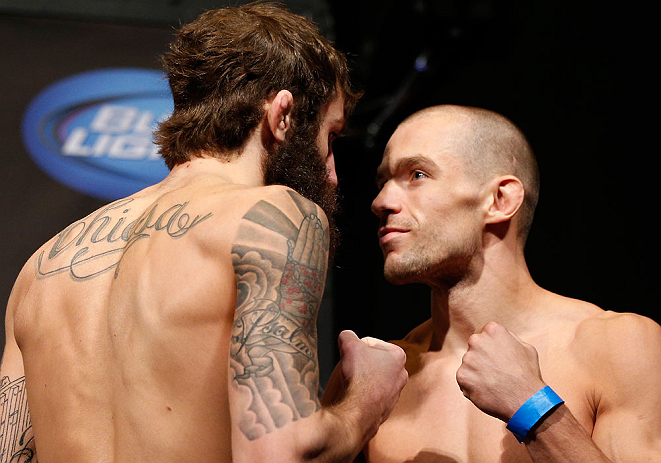 ANAHEIM, CA - FEBRUARY 22:  (L-R) Opponents Michael Chiesa and Anton Kuivanen face off during the UFC 157 weigh-in at Honda Center on February 22, 2013 in Anaheim, California.  (Photo by Josh Hedges/Zuffa LLC/Zuffa LLC via Getty Images)