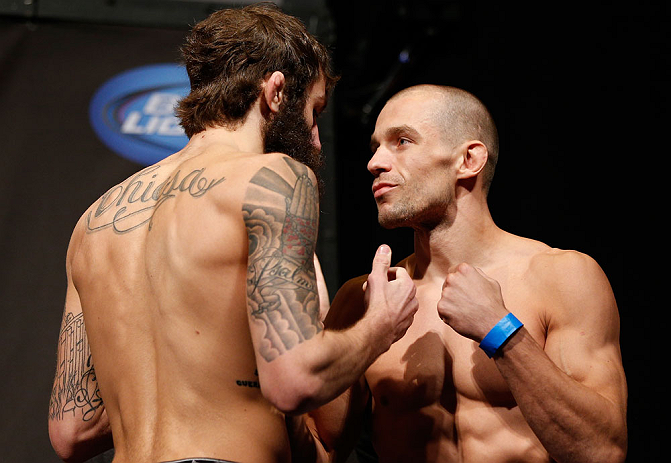 ANAHEIM, CA - FEBRUARY 22:  (L-R) Opponents Michael Chiesa and Anton Kuivanen face off during the UFC 157 weigh-in at Honda Center on February 22, 2013 in Anaheim, California.  (Photo by Josh Hedges/Zuffa LLC/Zuffa LLC via Getty Images)