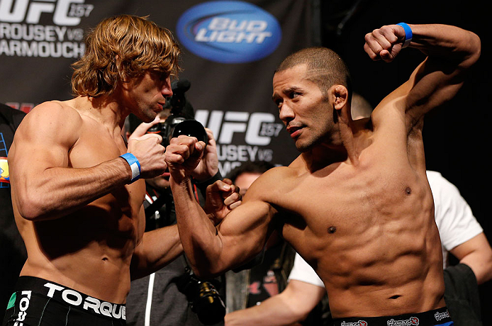 ANAHEIM, CA - FEBRUARY 22:  (L-R) Opponents Urijah Faber and Ivan Menjivar face off during the UFC 157 weigh-in at Honda Center on February 22, 2013 in Anaheim, California.  (Photo by Josh Hedges/Zuffa LLC/Zuffa LLC via Getty Images)