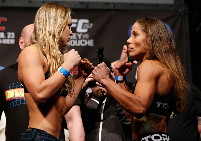ANAHEIM, CA - FEBRUARY 22:  (L-R) Opponents Ronda Rousey and Liz Carmouche face off during the UFC 157 weigh-in at Honda Center on February 22, 2013 in Anaheim, California.  (Photo by Josh Hedges/Zuffa LLC/Zuffa LLC via Getty Images)