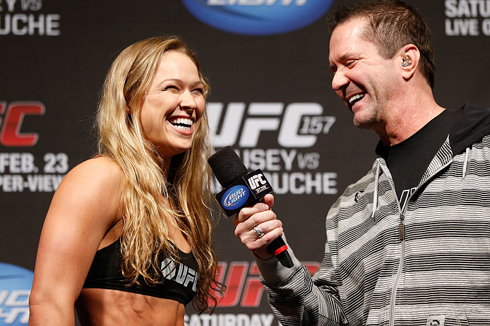 ANAHEIM, CA - FEBRUARY 22:  (L-R) Ronda Rousey is interviewed by Mike Goldberg during the UFC 157 weigh-in at Honda Center on February 22, 2013 in Anaheim, California.  (Photo by Josh Hedges/Zuffa LLC/Zuffa LLC via Getty Images)