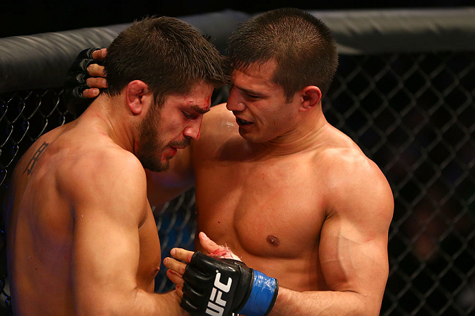 MONTREAL, QC - MARCH 16:  Bobby Voelker embraces Patrick Cote after their welterweight bout during the UFC 158 event at Bell Centre on March 16, 2013 in Montreal, Quebec, Canada.  (Photo by Jonathan Ferrey/Zuffa LLC/Zuffa LLC via Getty Images)