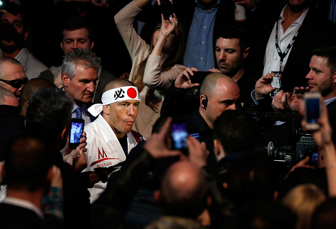 MONTREAL, QC - MARCH 16:  Georges St-Pierre enters the arena before his welterweight championship bout against Nick Diaz during the UFC 158 event at Bell Centre on March 16, 2013 in Montreal, Quebec, Canada.  (Photo by Josh Hedges/Zuffa LLC/Zuffa LLC via Getty Images)