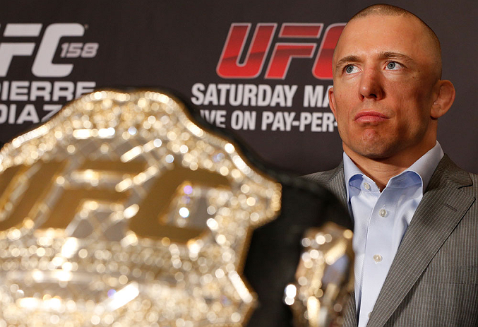 MONTREAL, QC - MARCH 14:  Georges St-Pierre interacts with media during the final press conference ahead of his UFC 158 bout at Bell Centre on March 14, 2013 in Montreal, Quebec, Canada.  (Photo by Josh Hedges/Zuffa LLC/Zuffa LLC via Getty Images)