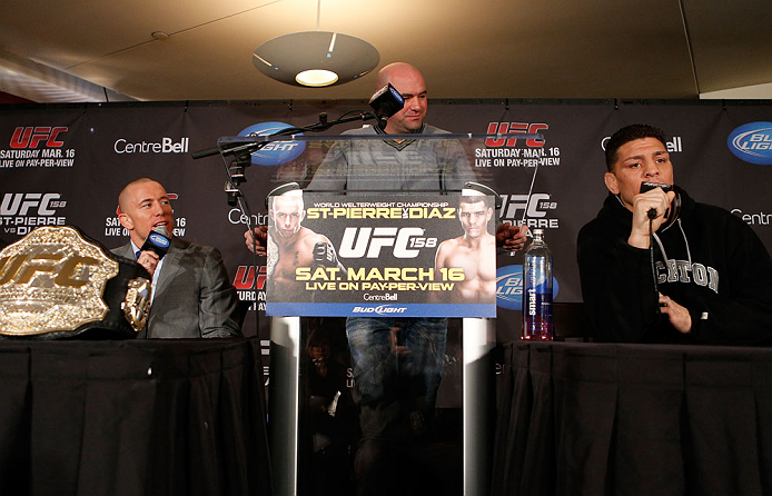 MONTREAL, QC - MARCH 14:  Nick Diaz (R) and Georges St-Pierre (L) argue with each other during the final press conference ahead of his UFC 158 bout at Bell Centre on March 14, 2013 in Montreal, Quebec, Canada.  (Photo by Josh Hedges/Zuffa LLC/Zuffa LLC via Getty Images)