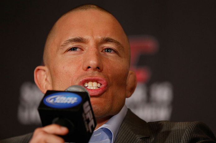 MONTREAL, QC - MARCH 14:  Georges St-Pierre interacts with media during the final press conference ahead of his UFC 158 bout at Bell Centre on March 14, 2013 in Montreal, Quebec, Canada.  (Photo by Josh Hedges/Zuffa LLC/Zuffa LLC via Getty Images)