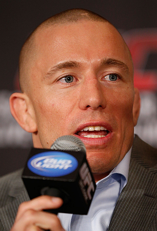 MONTREAL, QC - MARCH 14:  Georges St-Pierre interacts with media during the final press conference ahead of his UFC 158 bout at Bell Centre on March 14, 2013 in Montreal, Quebec, Canada.  (Photo by Josh Hedges/Zuffa LLC/Zuffa LLC via Getty Images)