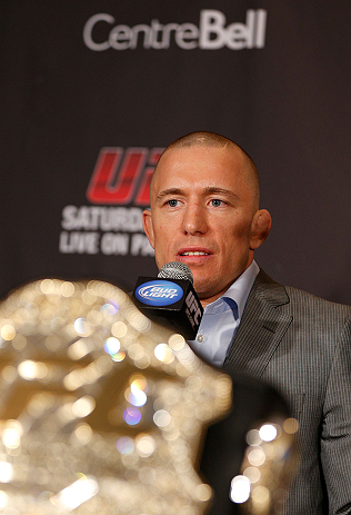 MONTREAL, QC - MARCH 14:  Georges St-Pierre interacts with media during the final press conference ahead of his UFC 158 bout at Bell Centre on March 14, 2013 in Montreal, Quebec, Canada.  (Photo by Josh Hedges/Zuffa LLC/Zuffa LLC via Getty Images)