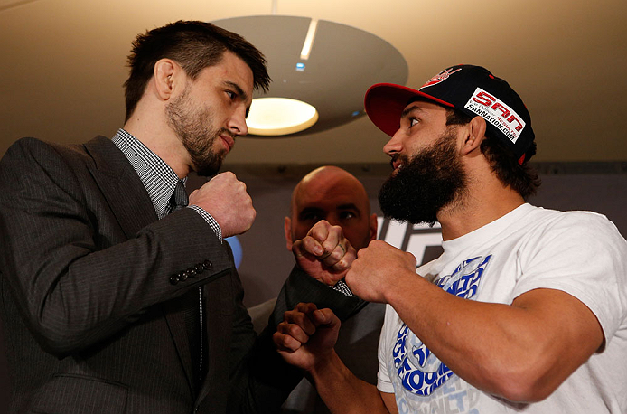 MONTREAL, QC - MARCH 14:  (L-R) Opponents Carlos Condit and Johny Hendricks face off during the final press conference ahead of his UFC 158 bout at Bell Centre on March 14, 2013 in Montreal, Quebec, Canada.  (Photo by Josh Hedges/Zuffa LLC/Zuffa LLC via Getty Images)