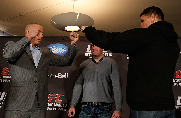 MONTREAL, QC - MARCH 14:  (L-R) Opponents Georges St-Pierre and Nick Diaz face off during the final press conference ahead of his UFC 158 bout at Bell Centre on March 14, 2013 in Montreal, Quebec, Canada.  (Photo by Josh Hedges/Zuffa LLC/Zuffa LLC via Getty Images)