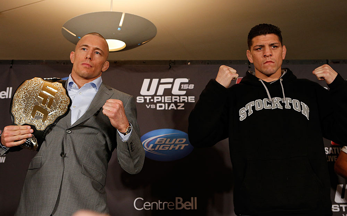 MONTREAL, QC - MARCH 14:  (L-R) Opponents Georges St-Pierre and Nick Diaz pose for photos during the final press conference ahead of his UFC 158 bout at Bell Centre on March 14, 2013 in Montreal, Quebec, Canada.  (Photo by Josh Hedges/Zuffa LLC/Zuffa LLC via Getty Images)